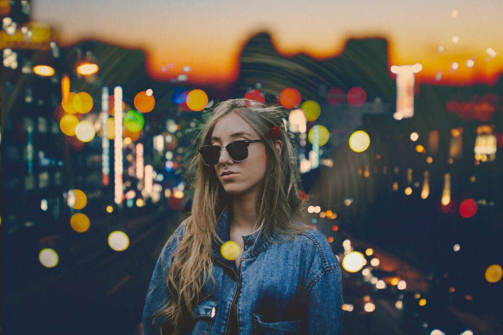 Woman Standing Wearing Blue Denim Jacket